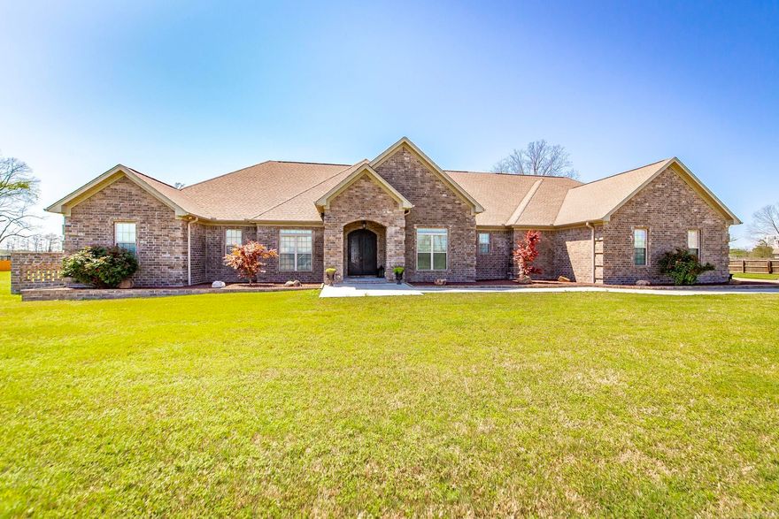 This beautiful lake property is an absolute must-see! Perfectly situated on 2.11 spacious acres, this custom-built home is thoughtfully designed for both luxury living & entertaining. Be amazed by the open layout, high-end finishes, & breathtaking views. The gourmet kitchen is a dream with double islands, slab countertops, double ovens, pot filler, & large pantry. Entertain guests in style in the sunroom, game room, or outdoor hot tub under a beautiful tongue & groove wood ceiling. Enjoy endless storage w/ an oversized laundry room, built-ins throughout, safe room, valuables room, & even a beauty salon. The home also includes 2 offices-perfect for working from home—or convert one into a 5th bedroom. The primary suite features a large sitting area & an attached fitness room. Additional highlights include: Surround sound throughout the home & shop, w/ individual room controls. Security system w/outdoor cameras, command room, & monitors. Detached shop w/half bath. 4-car garage w/epoxy flooring. Generac whole-home generator. Gazebo and covered outdoor seating areas for year-round enjoyment. Only 15 minutes to LRAFB or downtown. This home has it all including morning coffee with a view!