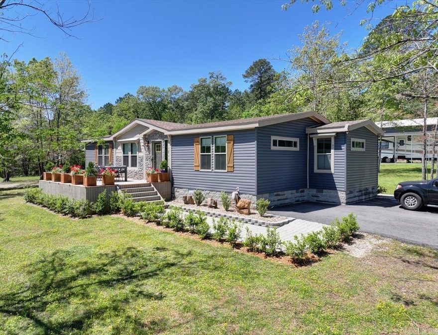 A fairly secluded improved land track off Amity Road. Property has an energy efficient manufactured home on a permanent foundation and includes about 10.84 acre. Home features a nice sized living room, beautiful kitchen with quartzite counters, dining area and a separate laundry room. Primary bedroom and bath with large glassed-in shower. Two other bedrooms and second main bath. Front deck overlooking a beautiful track of land. Rear covered deck and a concrete patio with water and power for possible hot tub nearby. In addition, there is an older 32'x60' clear span workshop, completely remodeled in last couple of years. Has a separate bathroom/shower, washer and dryer connections and a ceder closet, 2 power overhead doors and a personal door. In addition, a newer 25'x25' metal equipment shed with 2 overhead doors. Property was surveyed in 2021. Recently installed fiberoptic cable. Kimsey water with 2 meters and electric service with 2 meters. Covered RV pad. Several improvements done to property over the past 4 years. Lead base paint disclosure mainly for large workshop area. Square footage, age, taxes and other information from county records. Feel free to verify all information.