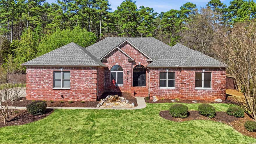 Completely renovated & expanded, this stunning home features an additional 842 sq ft with a brand-new second level featuring a bonus room, a private (5th) bedroom, and full bath—perfect for guests or additional space.  Inside, find a fabulously redesigned layout filled with elevated finishes, fresh paint, new bathrooms, new fixtures, and hardware throughout the home. The chef’s kitchen is a true standout with all-new appliances; complete with quartz surfaces, a butler’s pantry, & unique sliding windows that open directly to the patio—ideal for effortless indoor-outdoor entertaining.  The main level offers 4 spacious bedrooms and 3.5 baths, along with a light-filled office that makes working from home feel anything but ordinary. Luxury LVP flooring flows throughout the main living areas & downstairs bedrooms, adding both style and durability.  Step outside to a private backyard that backs to a lush tree line. A 3-car garage, tankless water heater, New Roof, 2 New AC units, and countless upgrades round out this exceptional property.  Tucked in the heart of Chenal, this home blends modern luxury with everyday comfort.  Schedule a showing today!