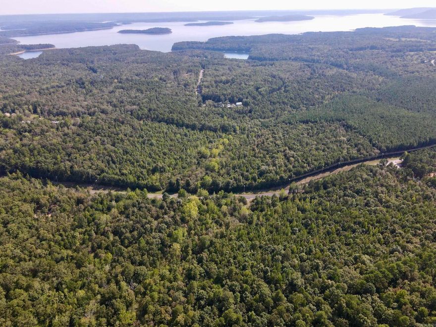 If you’ve been dreaming of lake living without sacrificing privacy, this exceptional property offers the perfect opportunity. Ideally situated on a paved county road and just 1.5 miles - less than five minutes - from Cherokee Park Recreation Area on Greers Ferry Lake, this location puts you at the heart of one of Arkansas’s most desirable lake communities.  Greers Ferry Lake is known for its crystal-clear water, boating, fishing, swimming, and family-friendly recreation. Cherokee Park offers convenient lake access, campgrounds, hiking trails, and picnic areas, making it easy to enjoy the outdoors every day. Nearby Mountain Ranch, Indian Hills, and Tannenbaum Golf Courses add even more lifestyle appeal, offering relaxation and recreation just minutes from your doorstep.  The property itself provides multiple ideal building sites, allowing you to design your dream lake-area home, weekend getaway, or private family retreat. Rock Branch Creek, a year-round water feature, flows across the land, enhancing the natural beauty and peaceful setting. The fully forested acreage creates a quiet, secluded atmosphere while still being close to all the lake amenities.  Additional acreage available