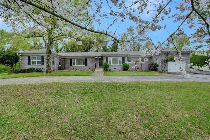 Move in ready home in highly desirable subdivision and Lakeside School District.  Solid structure built in 1960 with the exterior walls being block with a brick/stone appearance. This beautiful home has been completely updated. Split floor plan and 2 living areas with a fireplace in both. Original hardwood floors through most of the house with tile in bathrooms and kitchen. Lots of storage inside and additional storage building outside. Enjoy back yard entertaining with outdoor kitchen including built in grill and brick firepit with gas starter. Additionally a covered back porch with tv and room for lots of furniture. Long circle drive for plenty of parking. Large lot is over 1/2 acre all making this a "must see."