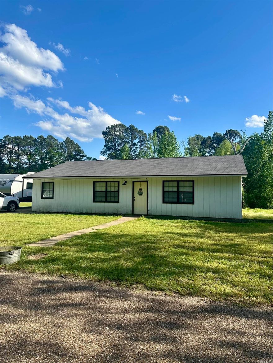 Experience country living with this charming 3-bedroom, 1-bathroom home nestled in the rural community of Glen Rose. Situated on 5 acres of flat, cleared land, this property offers endless possibilities. The home's open layout creates a seamless flow between living spaces. The spacious kitchen, with its built-in breakfast bar, provides convenience. The open dining area offers a warm and welcoming atmosphere, perfect for gatherings and everyday living. Journey outside to the back deck, a wonderful spot to enjoy the surrounding nature. Recent upgrades include a new roof and AC unit; both were replaced just two years ago.
