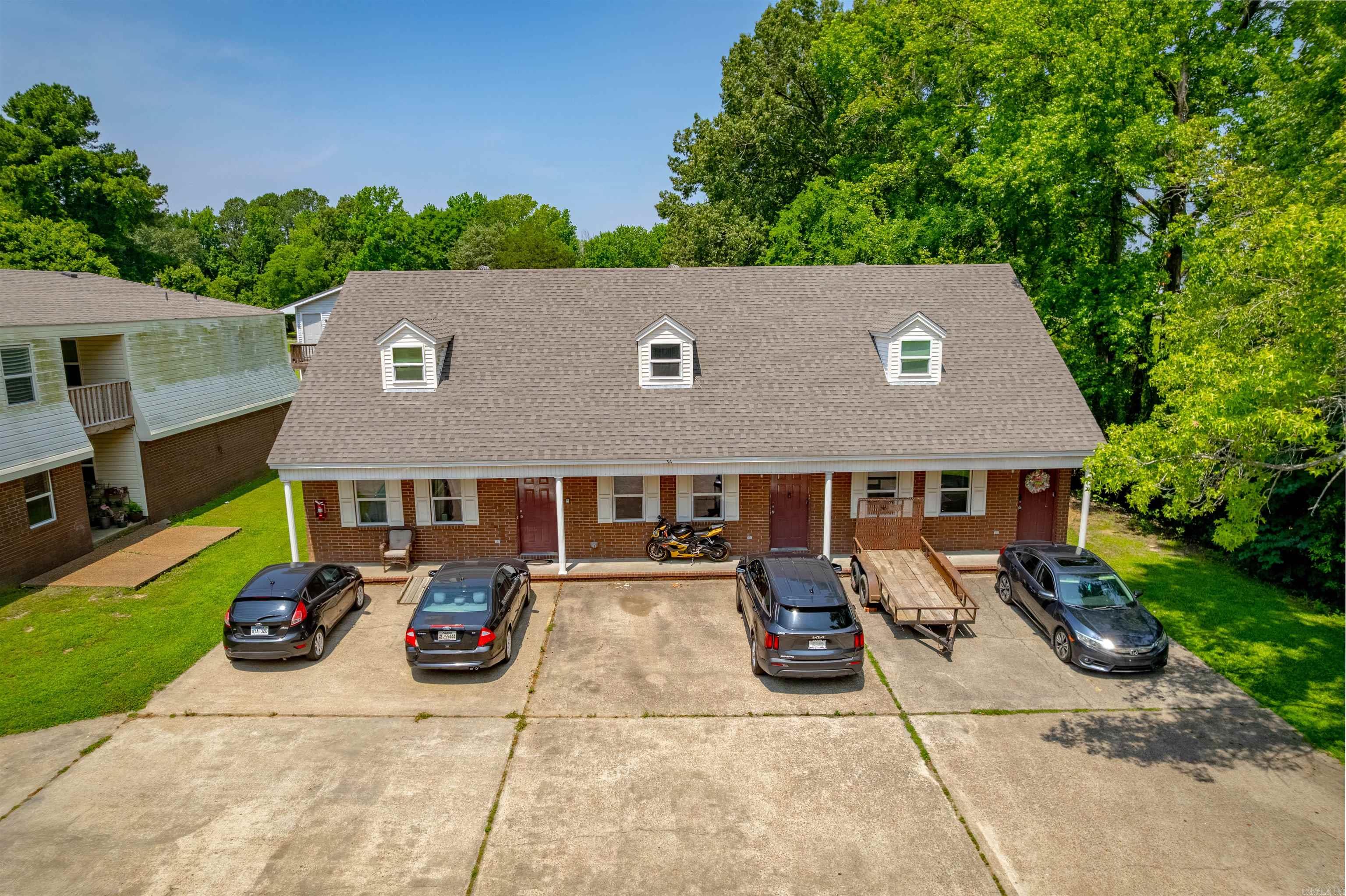 Brick Real Estate is pleased to bring this 7 unit apartment complex to the market. This deal has a mix of 3 spacious townhomes made up 2 bedrooms and two bathrooms, and 4 two bedroom one and a half bath apartment units. These apartments have undergone significant renovations including new roofs and windows. Interior renovations include new LVP flooring, paint, stainless steel appliances, and much more in select units. Please reach out for more information or to schedule a tour.