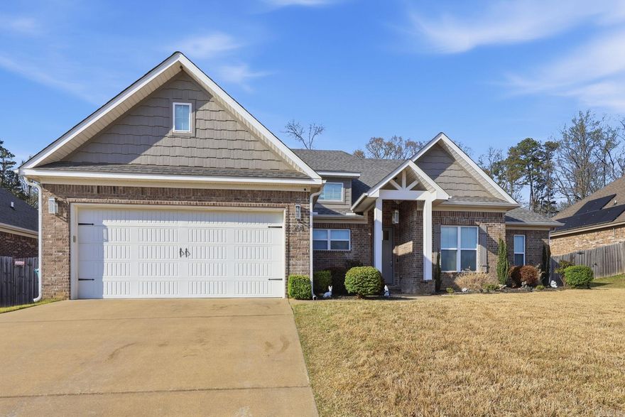 Welcome home to this beautifully designed 4-bedroom, 2-bath Craftsman-style gem located in the highly desirable Dawson’s Pointe community. From the moment you step inside, you’ll be captivated by the spacious open layout, soaring 11-foot ceilings, elegant crown molding, and stylish recessed lighting throughout.  The inviting great room is perfect for relaxing or entertaining, featuring a cozy fireplace with a charming wood mantel ideal for creating warm, memorable moments.  The chef-inspired kitchen is a true standout, boasting gorgeous granite countertops, stainless steel appliances, a convenient coffee bar, under cabinet lighting, and an abundance of cabinetry. The large pantry and breakfast bar (with barstools included!) make this space both functional and perfect for gathering. Retreat to the spacious primary suite, complete with tray ceilings and a luxurious en-suite bath featuring double vanities, a step-in shower with a rainfall fixture, and a separate soaking tub, your own private spa experience. The oversized walk-in closet offers plenty of room for everything you need. Come see this move-in ready home today.