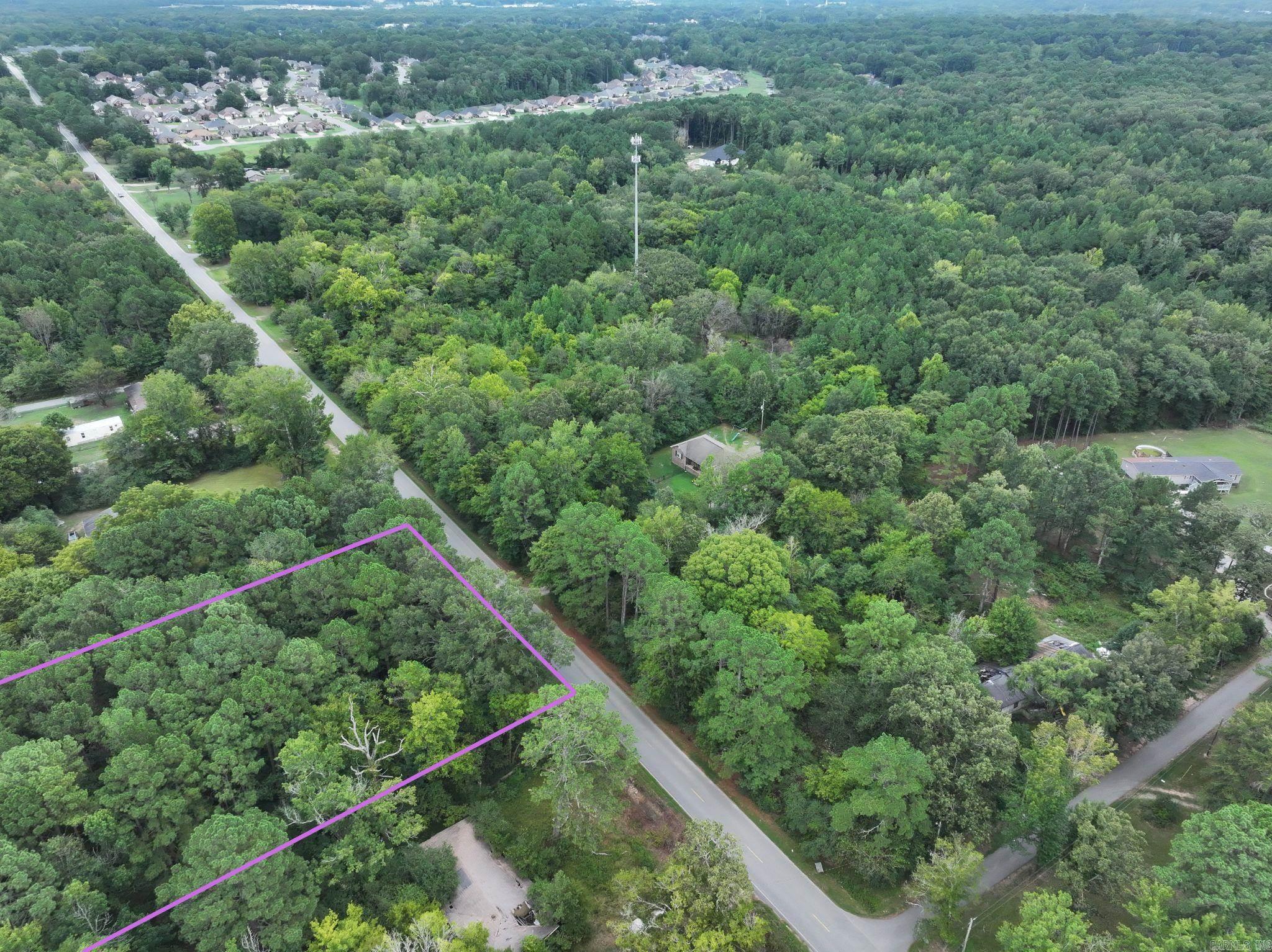 Wooded two-acre lot outside the city limits. Located in the Otter Creek area of Little Rock