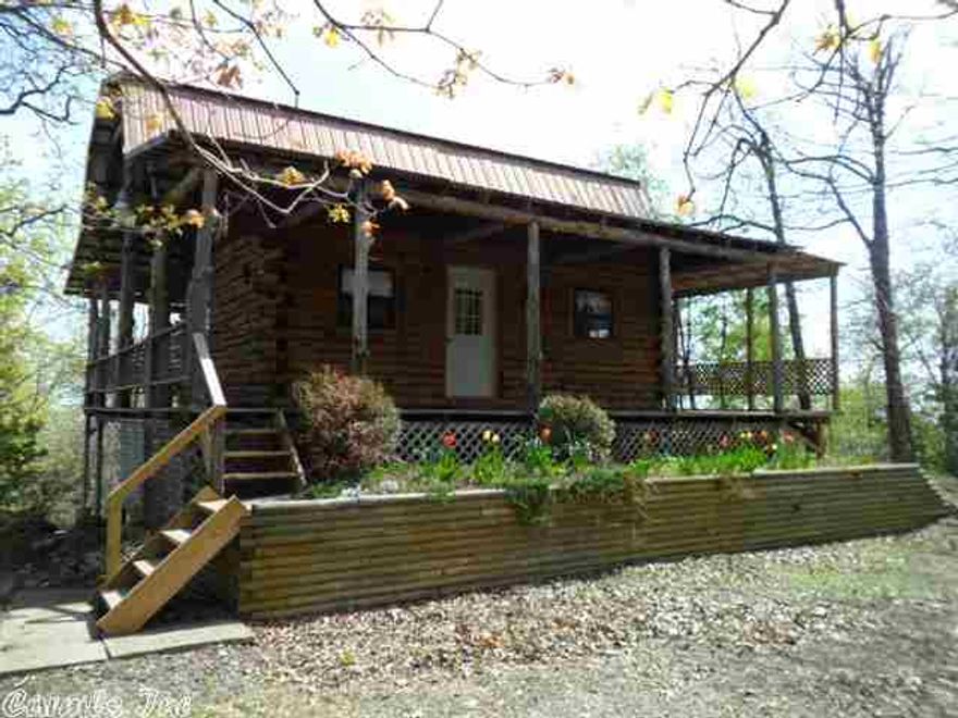 VIEW, VIEW, VIEW! Ozark Gem - log cabin, Wrap around porch, to enjoy the view. open floor plan, one bedroom, open living area, kit, plus loft bedroom, also a full basement, shop, and a very nice 36 acres of wooded land.  You have to see to believe the view.  Give me a call and let me show you this lovely property.