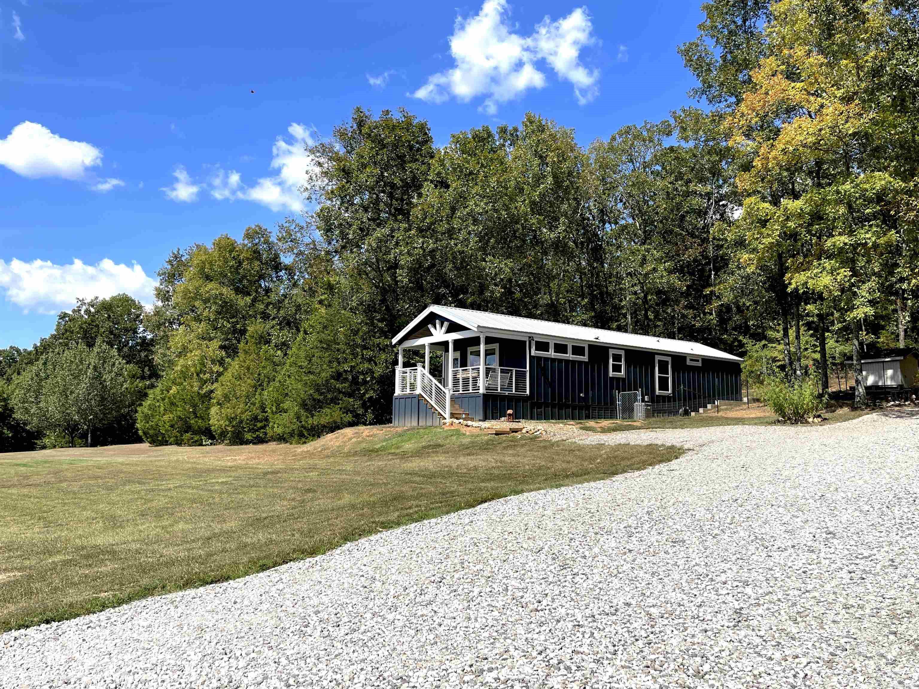 Easy Street, better get there soon! This gorgeous home nestled in the middle of 4 picturesque acres has the makings of an outstanding starter home or a relaxing retirement. Located minutes from Wooly Hollow state parkās 40 acre lake and miles and miles of hiking trails, this home would also be a superb vacation home. Custom built and including a bonus tiny home with bathroom on the property, this home just keeps on giving. Easy street⦠thatās where youāre gonna be!