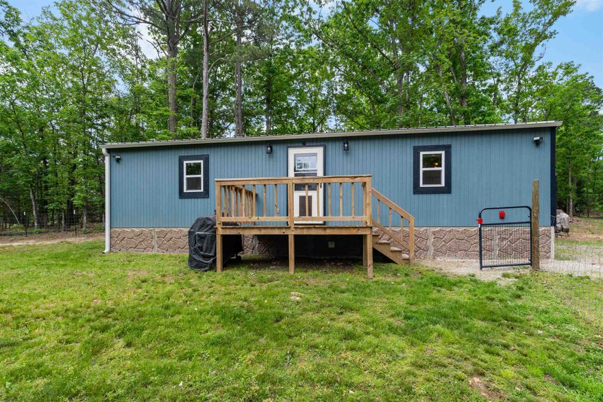 Completely remodeled home on 2 acres just outside of Melbourne! This charming home features an open concept living room and kitchen, complete with a cozy electric fireplace and a coffee bar. The home offers 2 bedrooms plus a convenient bunk area in the hallway. There is 1 full bathroom and an additional half bath. Step outside to enjoy a fenced-in yard, offering plenty of room for pets, play, or relaxing in the country setting. Move-in ready with modern updates throughout, don’t miss this one!