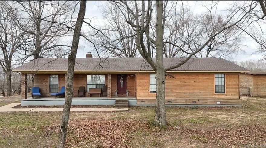 Room to breathe, privacy to enjoy, and updates already started.   Nestled on approximately 1.84 private acres with no future building on either side, this four-bedroom, two-bath home offers the space and seclusion you've been looking for. Wood siding adds timeless curb appeal, while major updates provide peace of mind, including a new roof (2024), HVAC (2021), and water heater (2026). Vinyl plank flooring runs through the kitchen, laundry, baths, and one bedroom. The master bath was remodeled in 2020 and the laundry room updated in 2026. Enjoy newer appliances, a cozy wood-burning fireplace, fenced backyard, and storage building.   With many big-ticket updates complete, this home is ready for its next owner to finish the remaining cosmetic touches and truly make it their own.  Call or text listing agent, Shea McAnally at 870-307-9406 to schedule a showing.