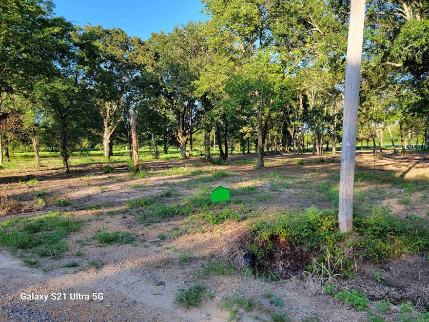 6.7 acres which includes 1 acre with trees & utilities, for $49,500.  If you are looking for a quiet area to live, just outside of town, you may want to look at this property. It has an acre lot with electricity, sewer, and city water, incase you would like to build a home. Several acres left for another home, shop, or a barn and plenty left to fence for horses or other animals.