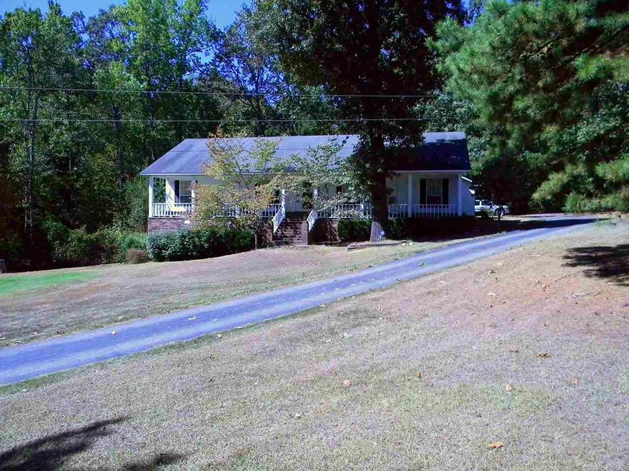 Custom built, lightly lived in home a wildlife oasis! Very private area of only 5 homes. 448 sf covered front porch very tranquil setting! Large open kit w lots of natural light, Lg Great Rm w wall of built ins & large sunroom/bonus rm & LG private deck backs to woods!Great floor plan flows well. Tiled enrty,trey ceiling, recessed lighting,LG walk in closets,Jacuzzi tub, tons of storage!!Rear garage door access to 416+ sf shop under hs w 220 elec & attic fan! Inside access for emerg, Many extras!! See Rmks!