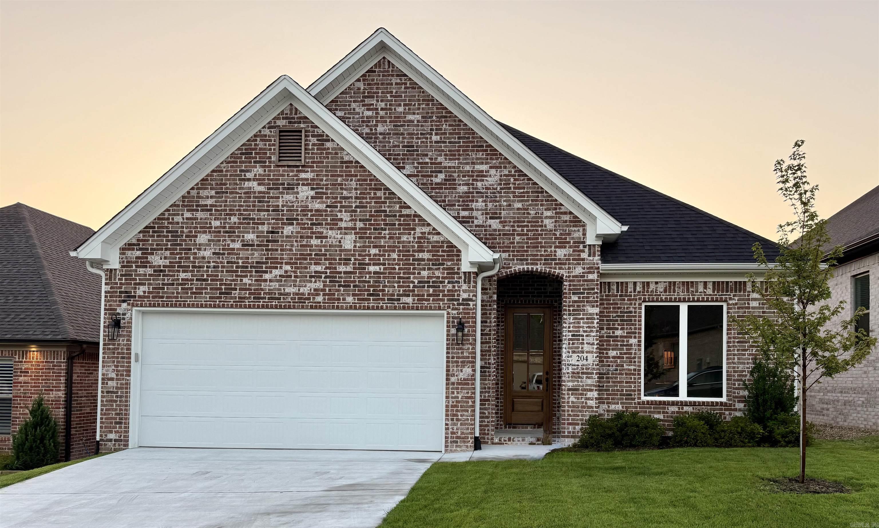 This stunning new construction home features an open-concept. The modern kitchen is a chef's dream, equipped with high-end stainless steel appliances, stylish cabinetry, and elegant countertops. The master suite is spacious including a walk in shower with sleek finishes. The laundry room offers conveniece. Lawn is landscaped with sprinkler system.