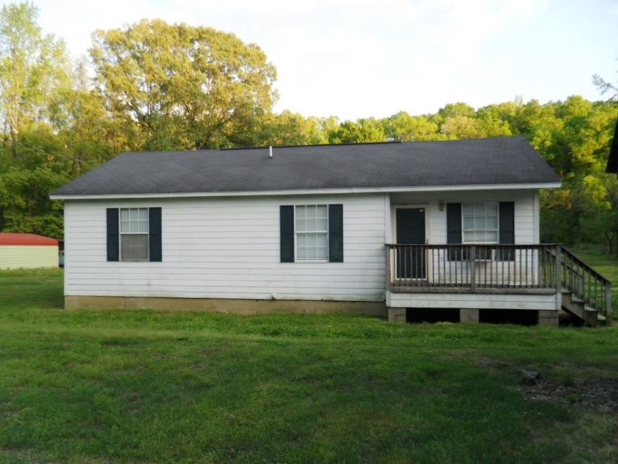 Great starter home!!!!   Needs just a little TLC!!  3 bdrm 2 bath sits off road for more privacy.  A shop for Dad.  Another building for whatever you need it to be.  Fruit trees!!  Sit on your deck and listen to the sounds of Mother Nature every evening. Even has a running creek to swim in if want to. Bryant School district.   All this at a great price!!!!!  Call before it is gone!!