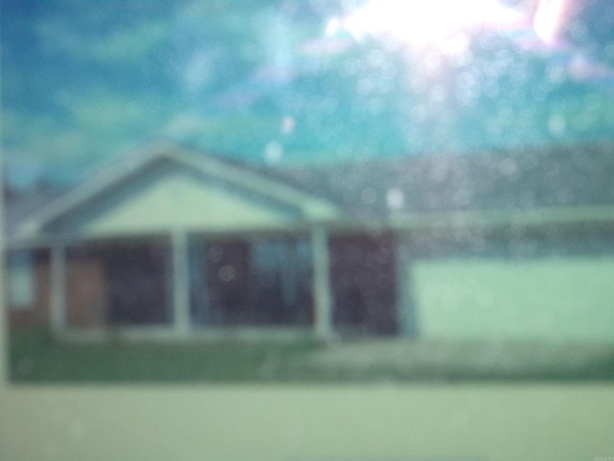 Spacious fenced backyard with separate garden spot fenced.  Storm cellar, double garage