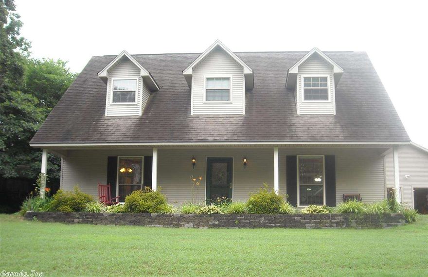 Nestled away on private driveway, Home offers abundant space, storage and charm. Featuring 3 bedrooms: Master Bedroom on main floor and 2 Bedrooms upstairs. 2 Full Bathrooms: 1 in Master Suite and 1 bathroom on 2nd Floor. On the 2nd Floor Bonus/Office Area. Kitchen has Island Bar with a Stainless Steel counter top. Kitchen Counter Tops/Back Splash are Tile. Eat In Kitchen opens to Great Room. Many windows for spectacular natural light throughout. Oversized Detached 2 Car Garage with lots of Attic Storage.