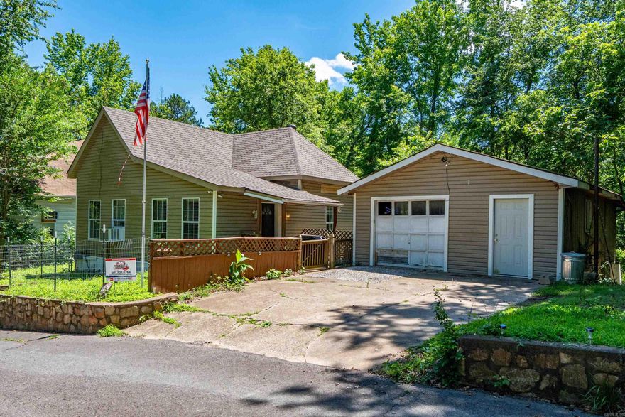 Charming 3-Bedroom Retreat on the Edge of Cedar Glade Mountain  Welcome to your next great opportunity! This 3-bedroom, 1-bath home offers a rare blend of city convenience and mountain tranquility. Nestled just a short walk to the base of Cedar Glade Mountain, the property gives you access to hiking trails, wildlife viewing, and peaceful, natural surroundings.  Step inside to discover a partially renovated interior with new luxery plank floors and a new roof along with new plumbing throughout, ready for your personal touch. Whether you’re looking to move in and make it your own or invest in a promising location, this home delivers. The detached garage provides ample space for storage, a workshop, or future expansion.  Located in a neighborhood where revitalization is on the rise, this property is a smart buy in a growing area. Despite being just minutes from shops, schools, and city amenities, you’ll feel like you’re tucked away in your own private woodland retreat.  Don’t miss your chance to own a home that combines the best of urban access and natural beauty. Schedule your showing today and see the potential for yourself!