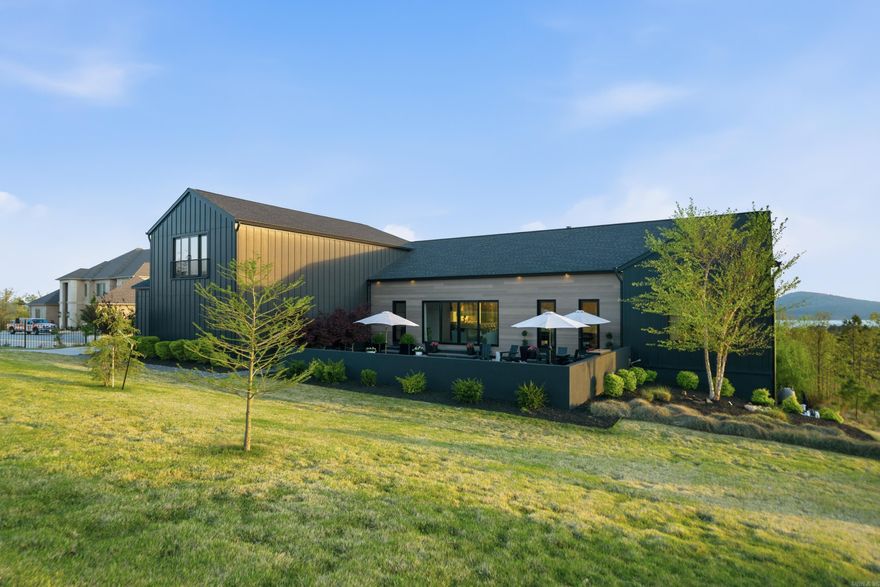 Stunning custom home by Dillon Homes, designed by Jill White Designs, situated on 2 acres in the private, gated Waterview Estates community with breathtaking views. This 4,457 SF residence offers 4 bedrooms, 4 full baths, and a powder room — every bedroom enjoys its own en-suite bath. Floor-to-ceiling Pella accordion doors seamlessly connect the living space to the pool and rear deck, creating an entertainer’s dream. White oak floors flow throughout the home, complemented by Fisher & Paykel appliances in the kitchen and a dedicated wine room and bar. The front-yard pool anchors the outdoor living, while a new $100K TimberTech deck (installed October 2024 by Sideco, Inc.) extends the entertaining space. Exterior finishes include James Hardie board-and-batten and MAC metal siding. Community amenities include tennis and basketball courts, soccer fields, walking trails, and scenic views of Lake Maumelle and Pinnacle Mountain — all just minutes from West Little Rock. Furniture negotiable.