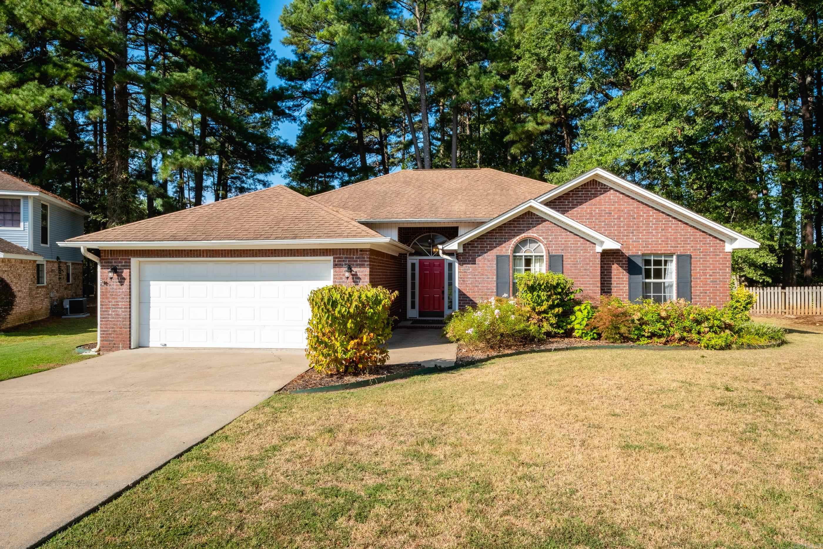One level brick, well maintained, large .35 acre level lot. Vaulted ceilings in den and primary bedroom. Wood laminate flooring, gas log fireplace in den, eat-in kitchen, breakfast bar, stainless steel kitchen appliances. Spacious laundry room complete with washer & dryer that conveys. Seller added fence, painted, flooring. Half of roof is 5 years old.