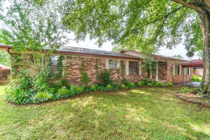 Welcome to this all-brick 3-bedroom, 2-bath home tucked away at the end of a quiet cul-de-sac! Surrounded by mature trees and backing up to peaceful green space, this property offers the perfect combination of privacy, comfort, and outdoor living. Inside you'll find two spacious living areas with a gas fireplace, hardwood floors, and a small office tucked away from the bedrooms. The spacious primary suite easily accommodates a king-sized bed and features a private en-suite bathroom along with a walk-in closet. Step outside to your own inground pool, gazebo, covered deck, workshop, and small pool house — ideal for relaxing evenings, hosting cookouts, or enjoying your private outdoor oasis year-round. Zoned for Cato Elementary and Sylvan Hills Middle, Junior High, and High School.