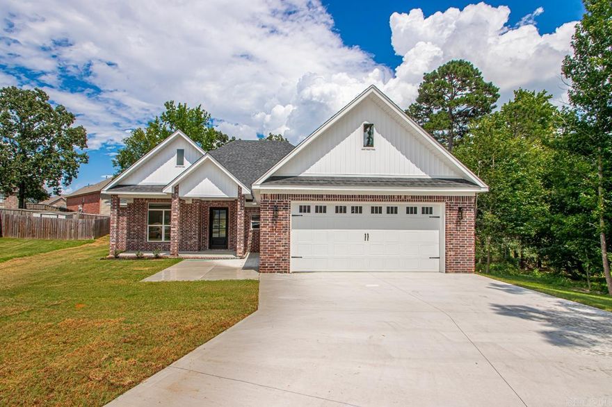 Buyers financing fell through! Back on the Market! New Construction! PRETTY! PRETTY! PRETTY! All brick! Big front porch! Room for the rockers to drink some sweet tea and relax! Split bedroom plan! Open floor plan for kitchen and family room! Very pretty electric fireplace w/ storage on each side built in! Beautiful floors throughout! Mud room w/ cubbies! 1/2 bath! Big garage w/ walkup attic and tankless water heater! Home sits on large pie shaped lot! Level! Cul-de-sac! Nice! The sun light just floods the space! Great storage! Tall ceilings! Come see today! Almost done! Covered porch out back! NICE!