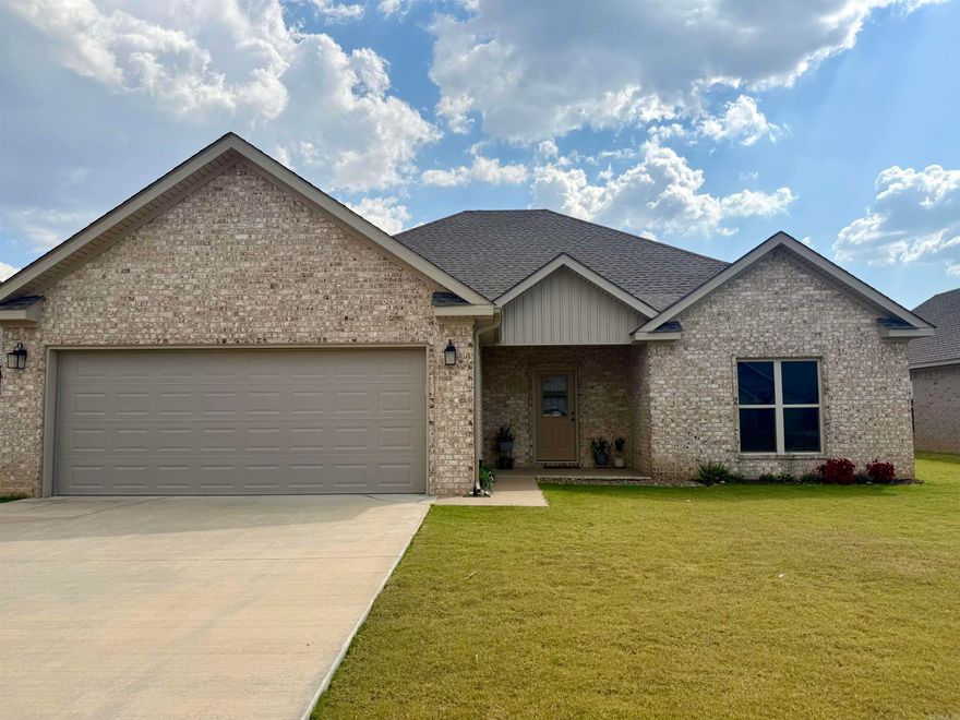 Built in 2023. this immaculate all-brick 3 bedroom, 2 bath home combines modern comfort with timeless style. A thoughtful split floor plan ensures privacy while keeping the living spaces open and welcoming. The spacious kitchen is a standout, featuring quartz countertops, a gas stove, breakfast bar, and an abundance of natural light. The living room is anchored by a beautiful gas fireplace, creating a warm and inviting centerpiece for gatherings.  The primary suite offers dual closets and a private bath with quartz countertops, while the second bath is equally upgraded with quartz surfaces. Both secondary bedrooms are generously sized for comfort. A bright sunroom provides the perfect spot to relax, and the privacy-fenced backyard is ideal for outdoor enjoyment. Additional highlights include a 2-car garage and modern efficiencies such as a gas tankless water heater.  From the quality finishes to the meticulous care, this home truly shines. With large rooms, upgraded features, and spotless condition, it’s one of the cleanest, most move-in ready homes you’ll find!