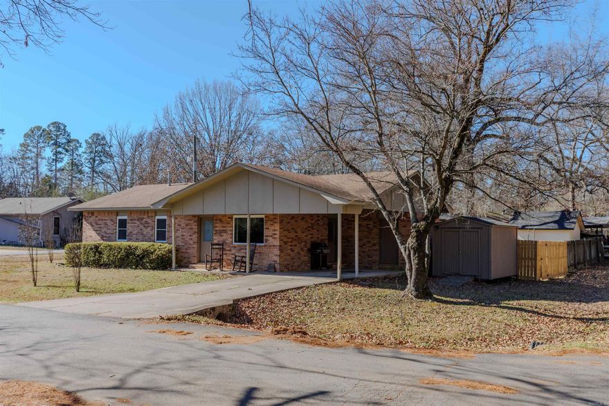 Hidden gem in Perryville, AR! This beautifully maintained and updated 3-bedroom, 1.5-bath home features all new windows, new paint, a new wooden privacy fence, and shines with pride of ownership. Immaculately clean and truly move-in ready, centrally located and within walking distance to Perryville High School—perfect for enjoying Friday nights under the lights.  The open floor plan offers comfortable living and entertaining space, highlighted by a spacious island. The primary bedroom includes a half bath with plenty of room to add a bath/shower if desired. An oversized storage room off the carport and an additional storage shed provide excellent space for tools and equipment. All of this on a .21 of an acre lot.    Don’t miss this opportunity—this home is ready for its next owners and checks all the right boxes.