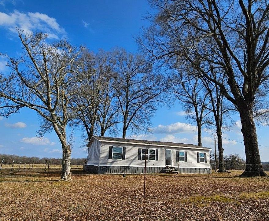 Serene 40 acres & 2022 mHome. Working cattle farm has 2 ponds, mostly pasture, haybarn, 28x50 machine shop, tractor shed & round pen. Home designed for style & comfort with mudroom/laundry room & full bath off side entry. Open living/dining/kitchen room. Sliding doors lead to deck the length of the home and access to side door. Huge closet in master suite! 90% of furnishings are negotiable even the cattle - you could move right in!!! Live the sweet life at #8 Van Marion!!