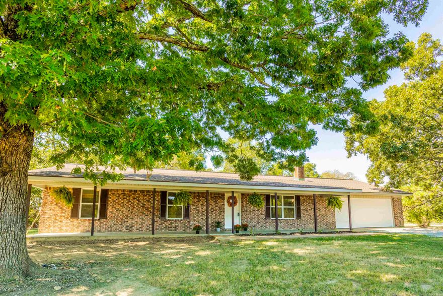Beautifully remodeled brick home not far out Hwy 36 W sitting on a couple of acres. House a very open floor plan with new paint, floors, doors, quartz, countertops, new appliances, a wonderful deep sink, tons of pull outs in the massive amount of cabinets, a nice stainless vent over the stove, new roof, new windows, new HVAC, just so much work has been done to this property. The living room, dining, and kitchen are all open and the laundry room is off the kitchen with a ton of space to make it also a great drop zone for backpacks, shoes, etc. There are 2 entrances to the house from the oversized garage. There is a pretty bricked area in the living room for a wood or pellet stove for back up heating, or could put the TV there. The bedrooms are all great size with nice large closets and the primary bedroom suite has a large walk in closet with built ins, and a walk in shower. The house sits way off the road and there is a a 30x40 wired shop with a double door plus a walk door. There is also a wired 16x20 storage building that could be a game room or just use for storage. There is a nice back patio. This property is private and just has so much to offer. Agents please see remarks.