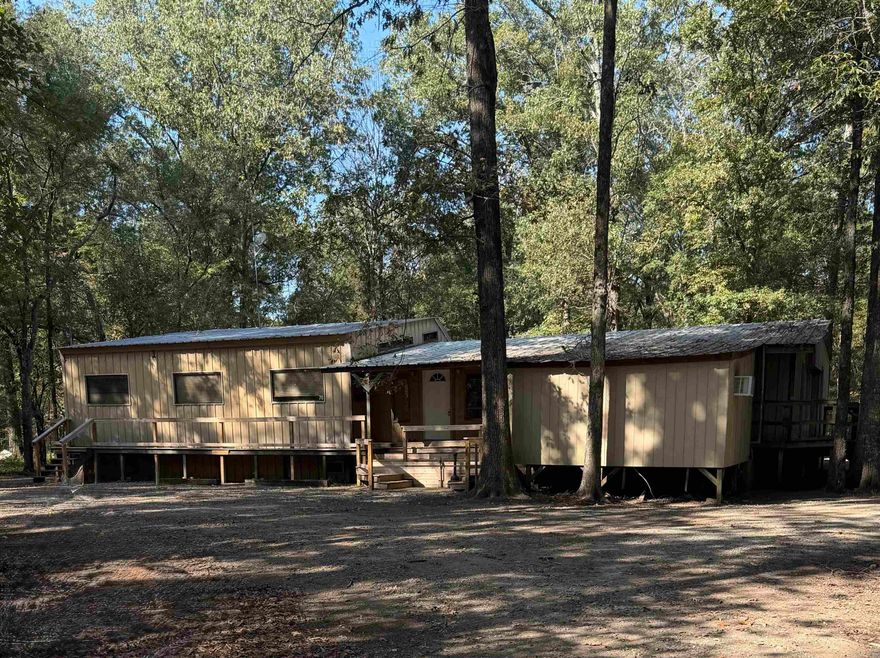 Rare opportunity to own a fully furnished camp.  The property is right down the road from Long Pond access, on the southern end of Bayou Meto WMA.  Saracen Casino is only approximately 20 miles away!    This spacious 2,320 sq ft, 5-bedroom, 4.5-bathroom camp is ideal for hunting groups.  The open-concept layout and recreational amenities make this a turn-key property you can enjoy from day one.
