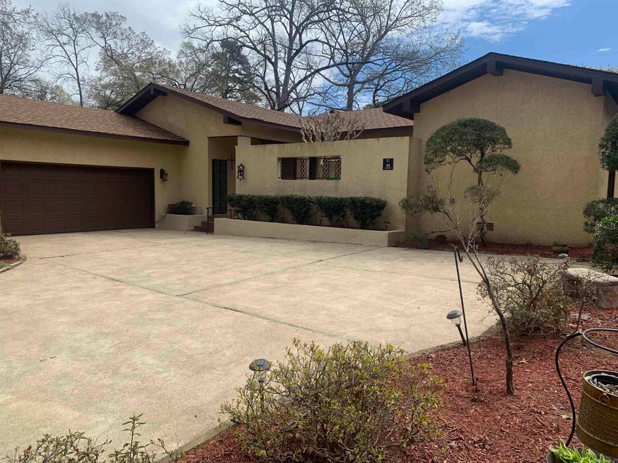 Come see this one-of-a-kind custom built home in the West Side of the Village. Enter this southwestern style home through the courtyard, which includes landscaping and inviting water fountain. Once you enter the home you will be greeted with beautiful hand made Saltillo tile in the entry area, traffic area, dining room, kitchen and utility room.  The living room has vaulted ceiling with beams and a large fireplace. Half bath has been updated with granite vanity and vessel sink. Two owners baths have been updated with new granite vanities, new tile and new matching Delta faucets/towel bars/grab bars.  All baths have tall boy toilets. Both owners bedrooms open to the courtyard.  Arkansas room is 32ft X 13ft with full sliding windows that open onto the landscaped yard and 17th fairway of DeSoto Golf course. Oversized 2 car garage with storage. Roof replaced in 2022, entire A/C unit replaced 2022, and mini split unit installed in the ceiling of Arkansas Room 2022. Moisture barrier throughout crawl space. Hot water circulator. HOME HAS $112,000 ASSUMABLE LOAN AT 3.5%.