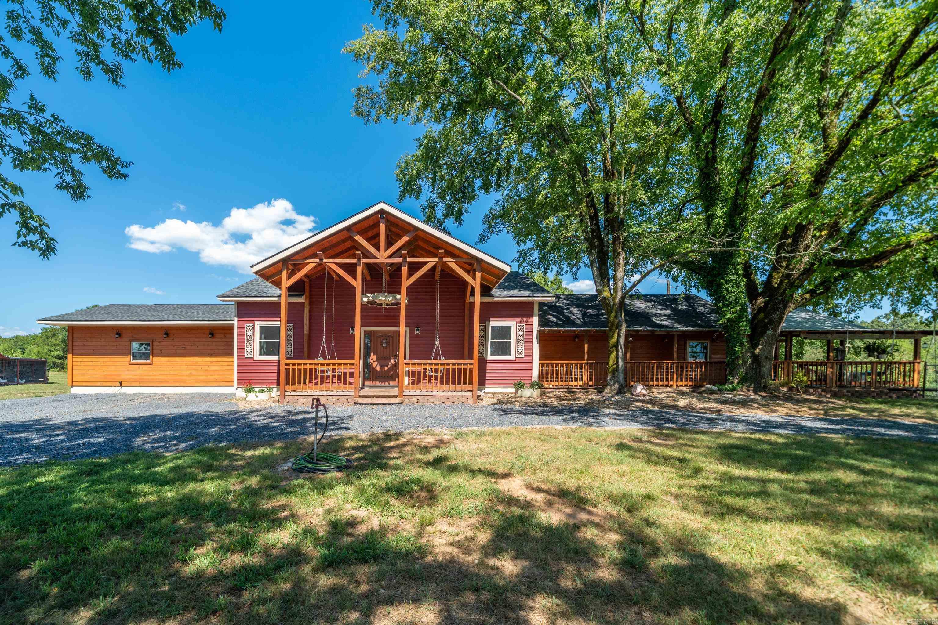Homestead Ready! ????? 4 bed, 3 bath home on 5 acres with custom cabinets, 500+ sq ft porch, chicken coop, storm cellar, and 2 covered sheds! Peaceful country living with space to grow and thrive! Home is directly across from Dragover Road. Land is absolutely impeccable. This home is the perfect setup for two primary suites! The one of a kind home is 3/4 of a mile from the Ouachita River - Floating and swimming area 6 miles from HW7 27 Fishing Village boat ramp -l * additional acreage can be purchased.