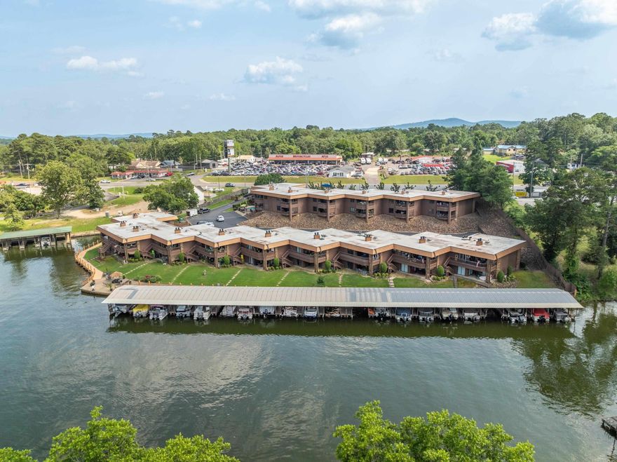 Enjoy Lake Hamilton living just steps from your own boat dock! Conveniently located gated ground level condo. Built-ins in primary bedroom and living area. Established family-like complex. Whether you are in search of your personal home or investment property, this unit is worth your attention.