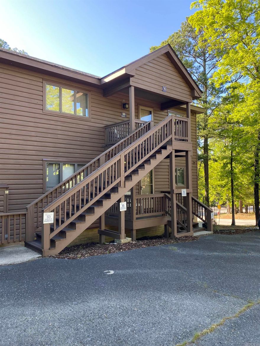 Harbor East condo at Mountain Harbor Resort on Lake Ouachita.  This 2 bedroom, 2 bath, upper unit condo has approx. 1,460 sq ft, with a large living/dining area, nice sized kitchen with plenty of storage and lots of natural light.  Sliding doors in the living area and bedroom open to the aggregate covered deck which is surrounded by trees. Unit is selling fully furnished!  Start the season off right with your very own lake place.   Don't wait, call today!