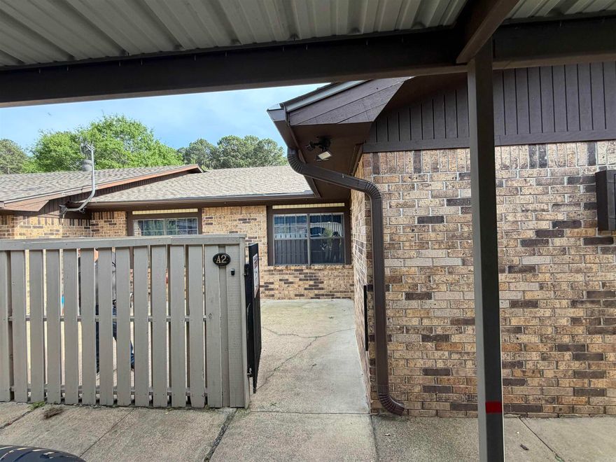 Welcome home to this large, bright and updated 2 bedroom 2 bath single story condo.  Awake to the peaceful setting and the birds singing and enjoy your morning coffee in your private courtyard or from your spacious deck overlooking the park like setting.  This condo features a newly remodeled kitchen with new appliances, new interior paint and no popcorn ceilings!  You will have peace of mind with a new HVAC , newer roof and gutters and 2 covered parking spaces close to your door.  You will have convenient access to all of Hot Springs amenities and attractions.