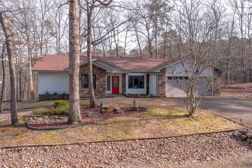 Nicely Remodeled One-Level 3Bed+Den Home on a 1/2 Acre Double Lot near Lake DeSoto Marina and Beach! WELL Maintained Home (New Roof w/Transferrable Warranty and Exterior Paint recently) on a Culdesac Street of '90's built homes! Over 1/2 Acre backs to 25 Acre POA Common Area for Privacy! Beautiful Wood Cathedral Ceilings w/Skylights, Stone Fireplace, Upgraded Cabinetry, Granite Island Kitchen, Split Floorplan! Primary Bedroom with Walk-In Closet and Bath with Jetted Tub +Walk-In Shower! Low Maintenance Yard, Vinyl Siding (Sides and Rear), Covered Rear Deck Overlooking Nature! Nice Sized 2 Car Garage + Separate Laundry Room, Large Shed with A/C unit and Garden Beds! Gated 26,000 Acre Hot Springs Village w/11 Lakes & 9 Golf Courses, Fitness Center, Swimming Pools, Beaches, Tennis, Pickleball, Mini Golf, Walking Trails, Clubs & Many Activities!