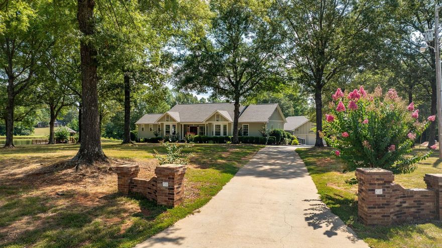 Gorgeous 10.71 acres surrounding this beautiful, well kept home!  One arrives down the flat driveway to this one level home with huge garage and abundant outdoor storage. The home is light filled with a fantastic floor plan & very large patio extending across the back of the home overlooking the gazebo & stunning pond.  The pond has pumps to keep the water fresh and well stocked!  There is a fantastic sunroom, vaulted ceiling in the large family room (wood burning fireplace) that is open to the kitchen!  Wonderful storage in the dining room as well tons of windows!  The well appointed kitchen has two dishwashers, a walk in pantry, double wall ovens as well as two sinks!  The primary suite has a wonderful walk in closet and nice bath with double vanity.   Three guest bedrooms with hall guest bath.  Two half baths.  Three car garage!  Generator and storm shelter on property.  Flat, manicured yard.