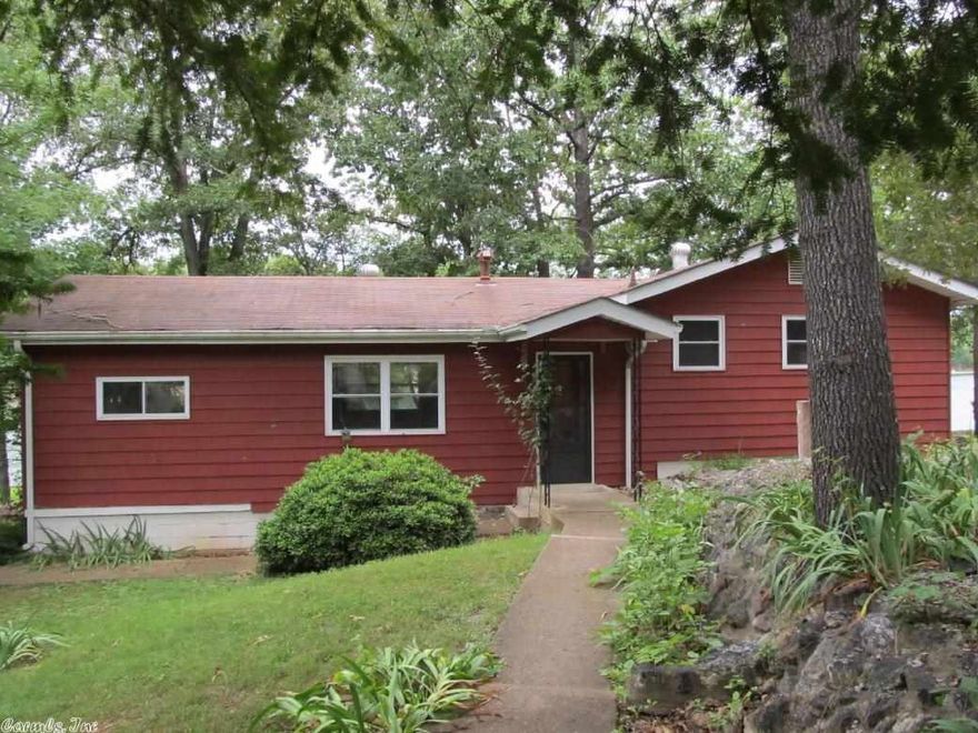 Located on beautiful Lake Sequoyah this home offers 2 bedrooms, full bath, bonus room and screened back porch. This home also has a swim/fishing dock. This would be a great vacation, investment or full time residence.