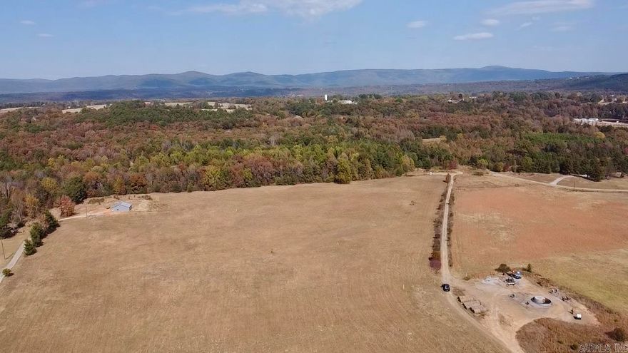 Conveniently located between Clarksville and Lake Ludwig just off scenic Hwy 21 spans over 10 acres of rolling meadows!  Few neighbors, a country setting, & easy access to utilities make this property the perfect location for your dream home or small subdivision.  No restrictions other than mobile homes.  Recent survey.  The property has great access and is only ¼ mile off of the pavement.  Several great building spots w/ views of surrounding woods and distant well kept properties.