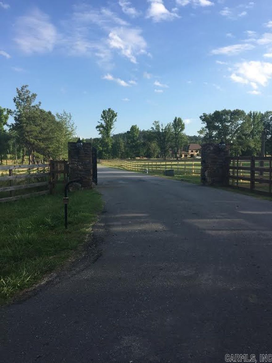 Beautiful and levell 5 acre tract in gated community in West Pulaski County with underground utilities including city water. Incredible opportunity to build your dream home with multiple building sites and room for horses. Enjoy the quiet life within minutes of Little Rock. See agent remarks for gate code. Also see  MLS #15021101  for information on adjoining acreage and MLS #15021104.