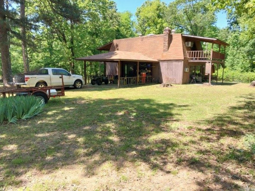 Beautiful setting for this 2 story fixer upper. 2 bedrooms, 1 1/2 baths with 8.62 acres. Nice metal shop building and storm cellar. Property has rural water and septic. Being sold in As Is Condition.