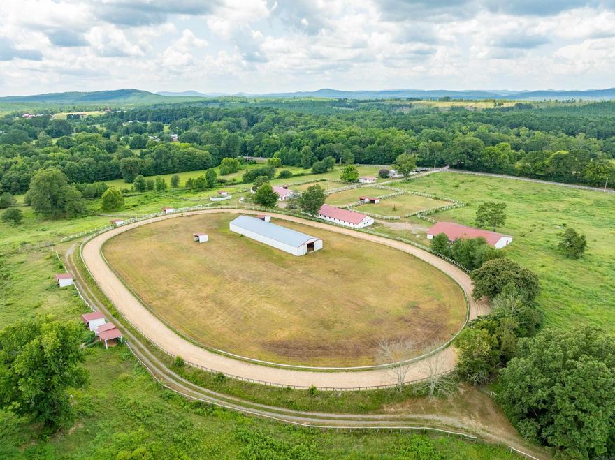 Beautiful Thoroughbred Training Center with Many Amenities, Renovated Farmhouse, Apartment for Farm Manager, Large Storage Barn,20-Stall Barn, 14-Stall Barn w/Office, Arena, Large very functional Hay Barn, 2-Hot Walkers, 1/4 Mile Training Track, Larger unfinished Training Track on South Side of property, All new/reworked Running Sheds and Outdoor Paddocks, New Metal Roofs on all main Barns,4-Ponds, Lots of Water, Country Beauty surrounds all the Pastures and Tracks with Lots of Space to Build additional Properties or Horse Facilites, Horses can Graze and Relax in the Open Air Space this Farm Provides.
