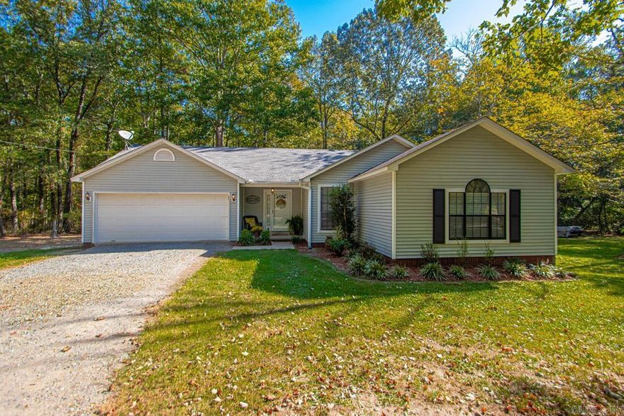 Escape to a private, three-acre sanctuary in the highly sought-after Amber Acre subdivision. This cherished 3-bedroom, 2-bathroom home offers the perfect blend of serene, country living. The thoughtfully designed layout creates a partially open flow between the living room, dining area, and kitchen, making it ideal for both daily life and entertaining. Stay cozy on cool evenings with a wood-burning stove in the living room, while the kitchen impresses with its beautiful cabinetry, a convenient bar for casual meals, and a charming bay window that fills the space with natural light. The home also includes a dedicated laundry room for added convenience. Enjoy the great outdoors from your back deck, perfect for grilling and gathering with friends and family. Two car garage. The expansive three-acre lot provides exceptional privacy and even offers a designated area for hunting right behind the property. Additional features include a roof that is approximately nine years old and numerous updates throughout, a testament to the home's loving care. Located just off Highway 35, this property provides a rare opportunity for secluded living with easy access to Benton amenities. See Remarks