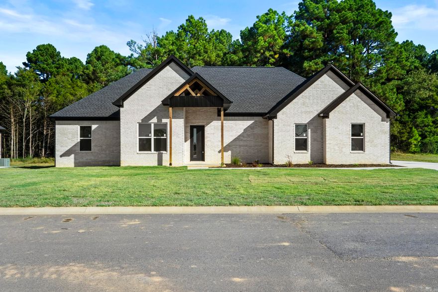 Located in the prestigious Belmont Estates and just minutes from Searcy Country Club, this stunning new construction home offers over 2,200 square feet of modern elegance. Designed with an open floor plan and tall ceilings, the home features spacious, light-filled rooms, a modern fireplace in both the living area and the luxurious master suite, and a chef’s kitchen with top-of-the-line appliances and sleek cabinetry. The master suite boasts a spa-like bathroom with dual vanities and a walk-in closet, while the mudroom adds convenience and organization to your daily routine. A spacious garage provides ample room for vehicles and storage. With its clean modern design, high-end finishes, and opportunity for personalized touches, this home is perfect for those seeking luxury and comfort. Don’t miss your chance to make this incredible home your own. MOVE IN READY!