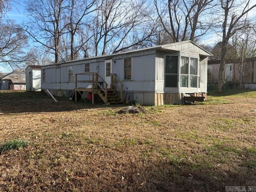 This 2-bedroom, single-wide mobile home sits on a wide corner lot in Hatfield city limits, with city utilities. A great starter home for the price, but it needs a few repairs and some TLC. A storm cellar is conveniently located on the property. The shed does not convey. Property to be sold as is, where is. Agents, see remarks