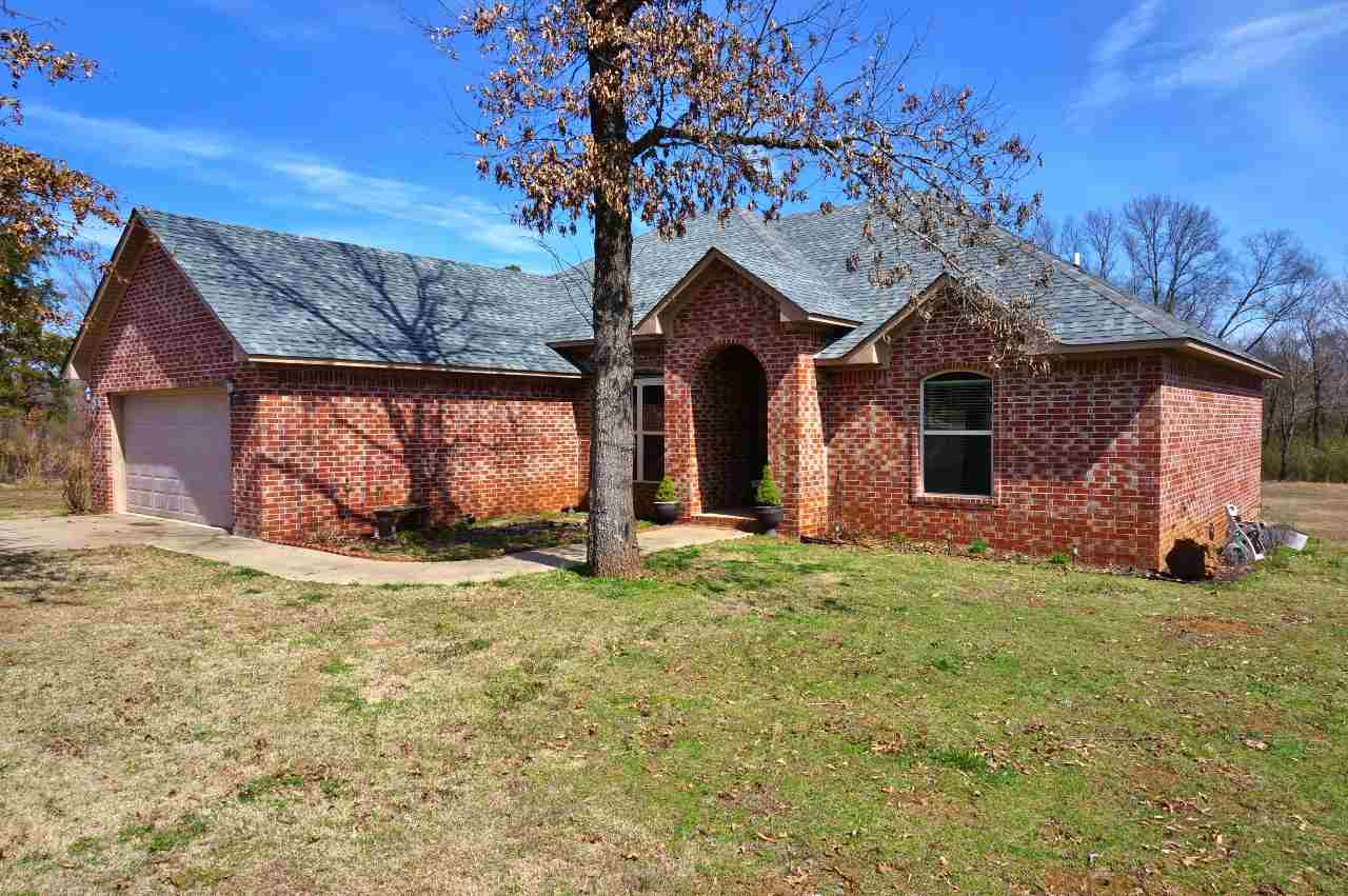 Very nice 3BR, 2BA brick home with contemporary styling in quiet country subdivision. This home has a split floor plan, with the master suite apart. Pretty entryway and unique dining space make the home very inviting. Large bedrooms, big yard, 2-car attached garage, separate laundry room, and deck to grill out on in back. All of this in a one-owner home built in 2008! Mill Creek runs just below property, so no worries about any homes being built right in your back yard. Come take a look!