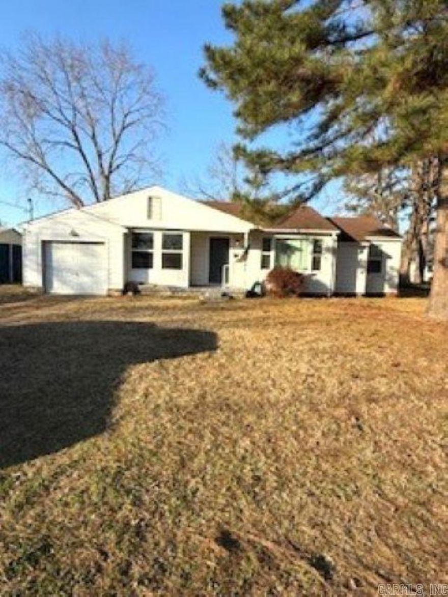 INVESTORS or First time buyers...3bd/1ba home in NLR with attached 1car garage. Previous updates include kitchen, bathroom, refinished hardwood floors, plumbing, both water and sewer, dishwasher, refrigerator to convey, newer energy efficient windows and more. Needs a little TLC to shine again. Huge back yard with drive thru gate and new storage shed. Close to shopping, elementary school and Camp Robinson. Come take a look! Agents see remarks.