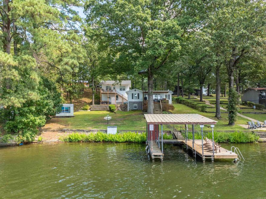 Two-for-one lakefront paradise! The main house is a charming 2 bedroom, 1 bath cottage with tasteful lake home decor. Also includes a 2 bedroom, 2 bath apartment. Both homes are very successful in generating income as vacation rentals. This property would be perfect for a waterfront retreat that also produces passive income when not being used. Some of the features include two decks with hot tubs, boat dock with lift, large lot with 100 feet of lakefront and wonderful lake views.