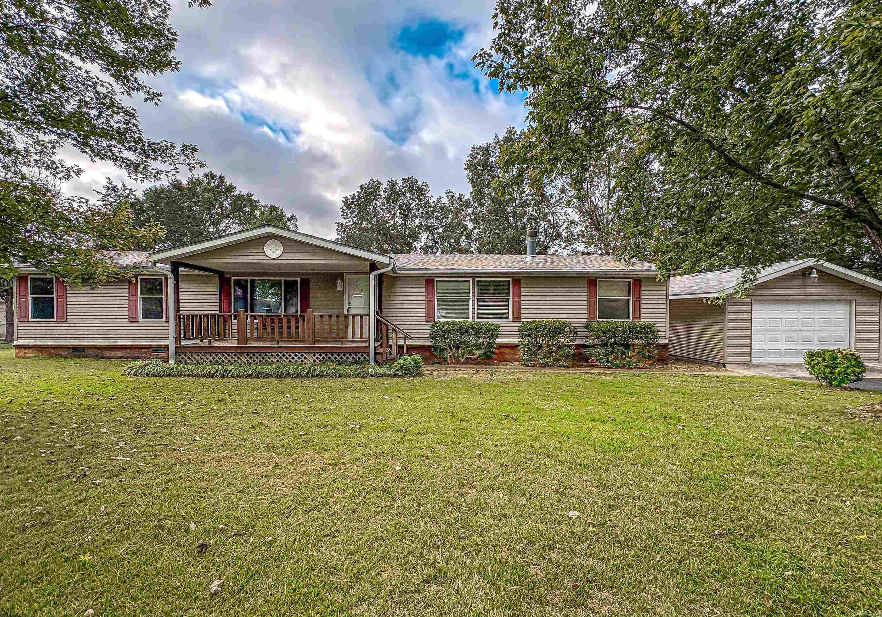 This well-maintained property is located in a quiet subdivision, just minutes from town. It features a new roof and a new HVAC system, ensuring comfort and efficiency year-round. The home offers two spacious living rooms, perfect for entertaining or relaxing with family. A cozy gas fireplace adds warmth to the main living area, making it an inviting space during cooler months. The layout is functional and designed for easy living, providing ample room for both leisure and daily activities. With its recent updates and prime location, this home presents an excellent opportunity for those seeking convenience without sacrificing tranquility.