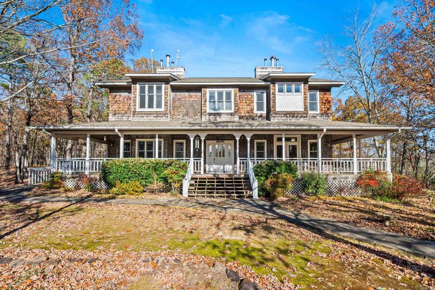 Welcome to your own Hallmark movie set!!! This home has the looks of a historic inn with all the modern conveniences of a much younger building. Located less than 30 minutes north of Historic Hot Springs and nestled on approximately 9 acres for a tranquil getaway, the home has 8 charming guestrooms of varying sizes and ensuite bathrooms (4 are appointed with gas fireplaces). A wrap around porch welcomes guests and also provides wheelchair access to the inn. A parlor with stocked bookcases provides a place to read by the fire while a guest pantry allows for easy access to coffee, tea, and snacks. And, the dining area will seat your guests for breakfast or special meals.  The kitchen has a commercial grade gas stove and plenty of prep space and appliances to accommodate serving guests.  The owner's quarters has 2 bedrooms with ensuite bathrooms and a private living room and screened porch.  The basement has ample storage with easy access to furnace,2 BRAND NEW water heaters, etc. plus a 2 car garage. Brand new HVAC units and thermostats fro better energy efficiency.  Currently used as a Bed & Breakfast inn, this would be a great home for a large, multi-generational family!