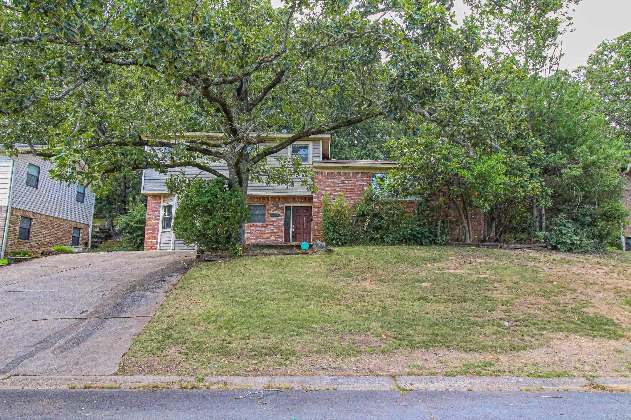 Charming Tri-Level Home in Midtown with Flexible Living Space! Welcome to 8304 Red Oak Lane ā a well-maintained tri-level home offering 4 bedrooms, 1.5 baths, and a spacious, flexible layout in a prime Midtown Little Rock location. On the first level, youāll find a versatile space featuring a bedroom or office, a second living area or bonus room, and a convenient half bath. The second level is the heart of the home, showcasing a warm and inviting living space with a wood-burning fireplace, a bright kitchen with oversized cabinets and expansive counter space, and a breakfast nook perfect for casual meals.Upstairs on the third level, you'll find three additional bedrooms and a full bath, all filled with natural light and tucked away for privacy. Step outside to enjoy a large fenced backyard with a large deck, perfect for entertaining or relaxing. Major updates include a 2022 roof, adding peace of mind for the next homeowner. Located in a quiet, established neighborhood with easy access to shopping, dining, hospitals, and I-630, this home offers both space and location at a great value.